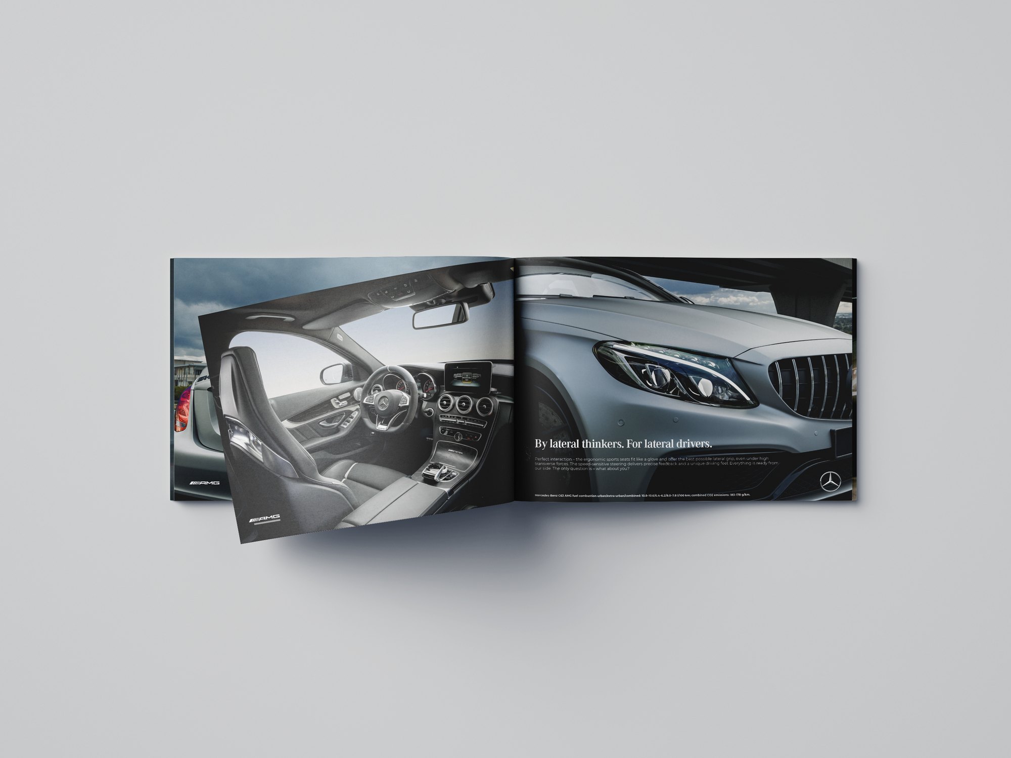 Mockup of the printed Mercedes C63 AMG brochure open on an interior spread
