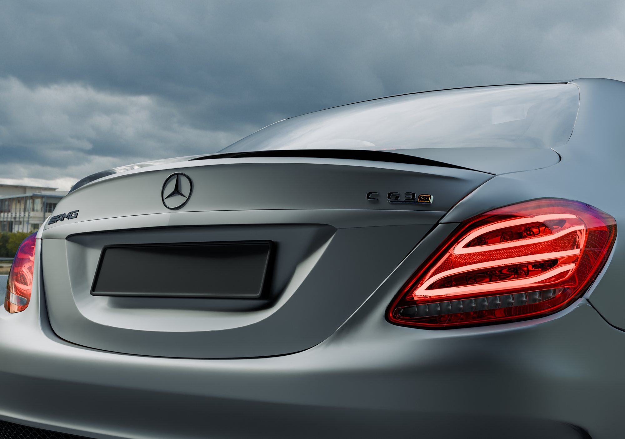 Macro of the rear with the red tail light and C 63 badge